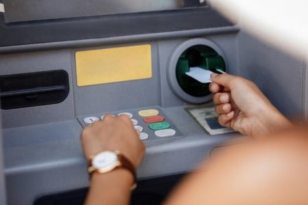 Woman Using ATM Withdraw Money From EBT Card For Free - Concept